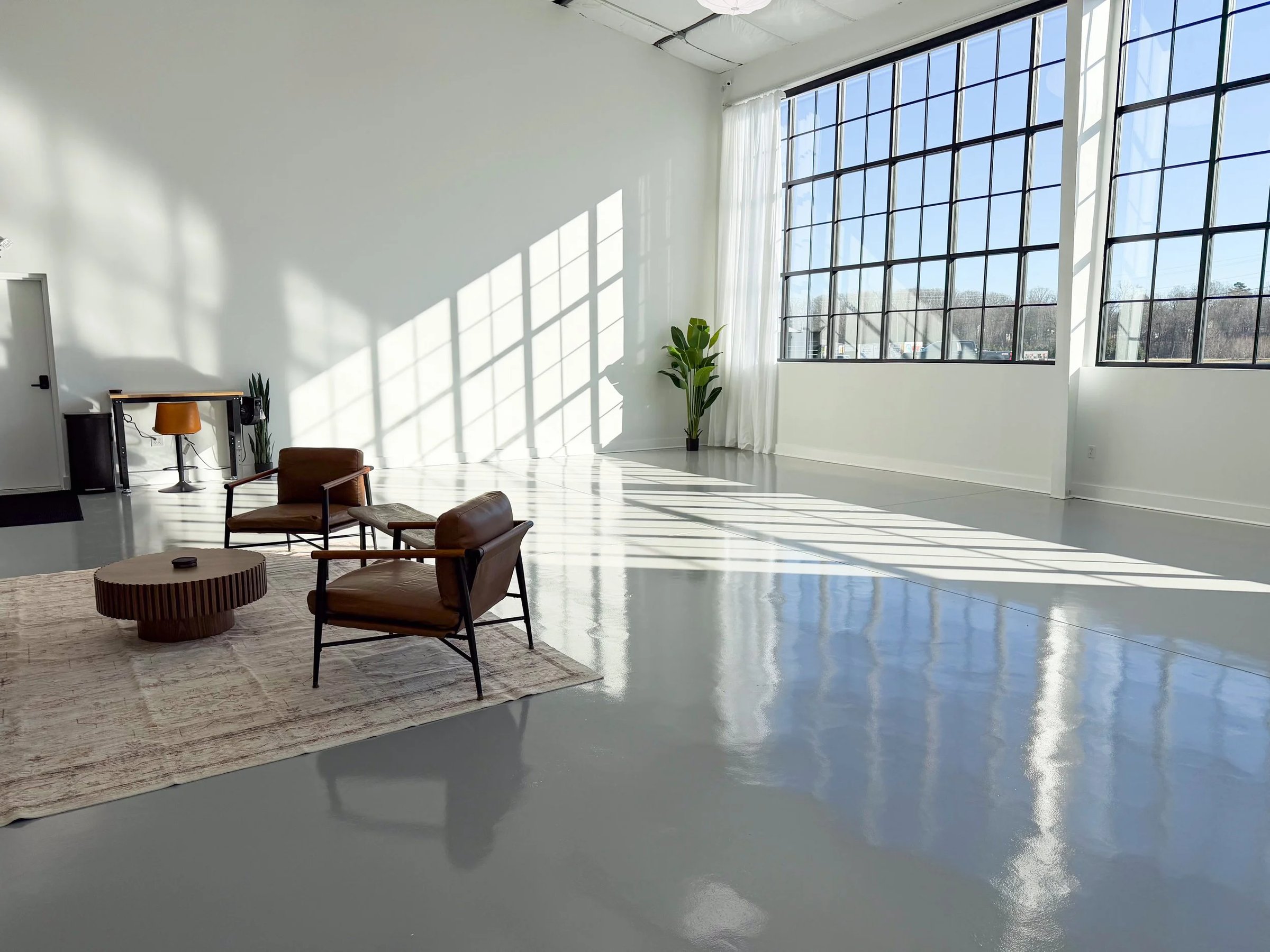 Natural light pouring through the tall windows of the WhiteWall Studios flagship in Powdersville